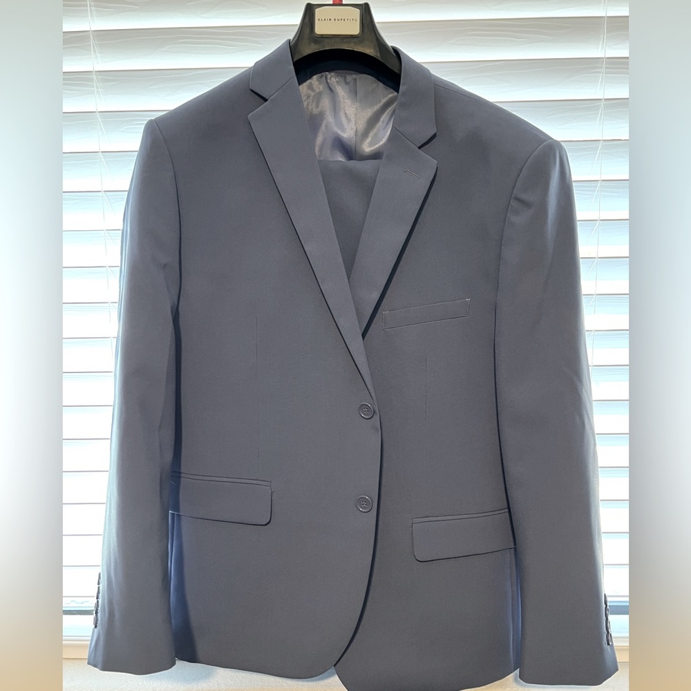 Baby blue summer men’s suit. Tailored chest at 44S, waist at 32x30. Worn once.